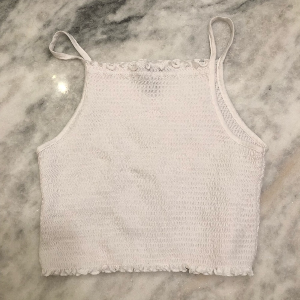 white crop top with ruffle features.